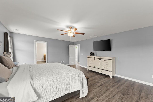 bedroom with dark wood-style floors, visible vents, baseboards, and a ceiling fan