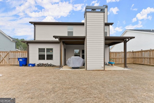 back of house featuring a patio and fence