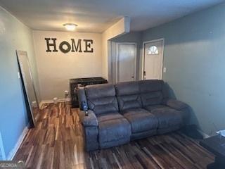 single story home with concrete driveway and covered porch