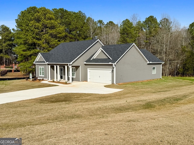 view of front of home with driveway, a front lawn, and roof with shingles