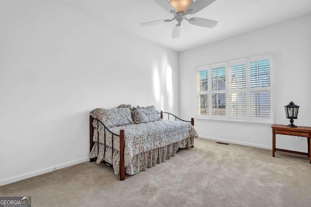 bedroom with carpet, visible vents, baseboards, and a ceiling fan