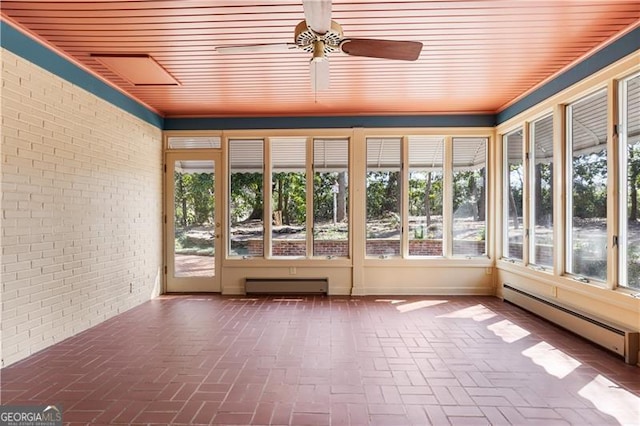 unfurnished sunroom with baseboard heating, ceiling fan, and a baseboard radiator