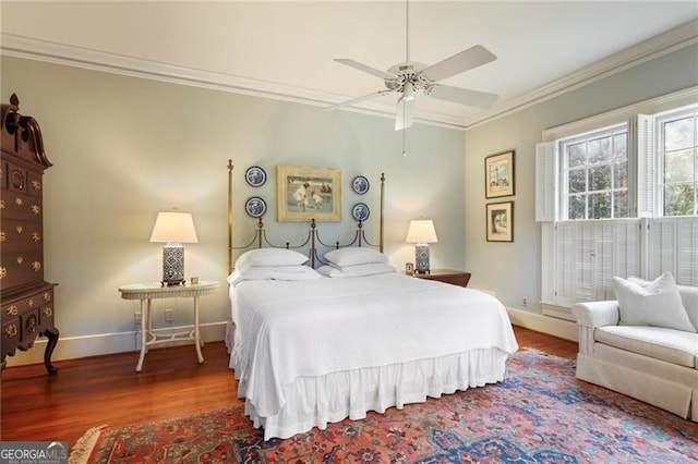 bedroom with wood finished floors, a ceiling fan, baseboards, and ornamental molding