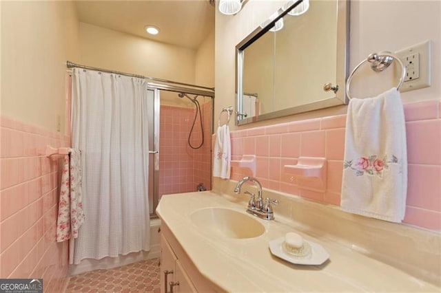 full bathroom with vanity, tile walls, shower / bath combination with curtain, and recessed lighting