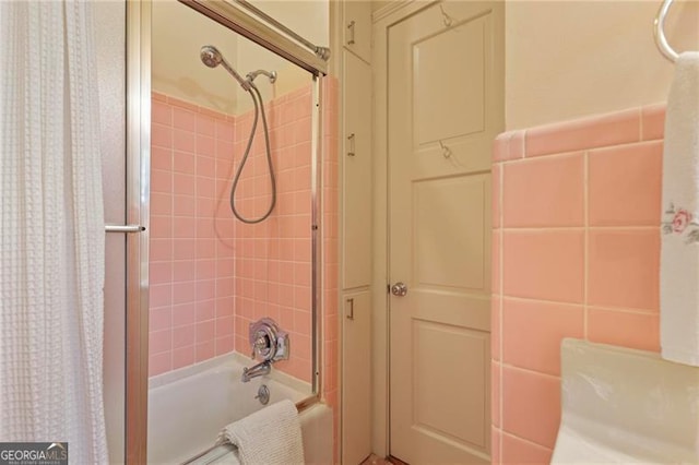 full bathroom with shower / bath combination with curtain and tile walls