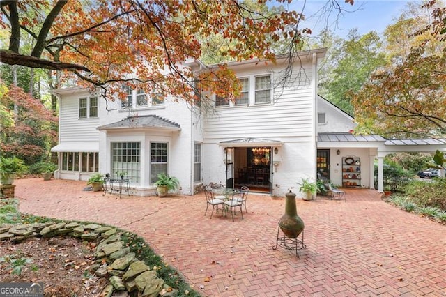 rear view of property with a patio area