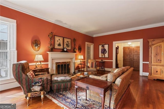 living room with a glass covered fireplace, crown molding, and wood finished floors