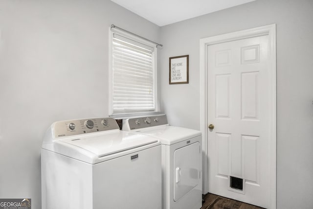 laundry room with dark wood-style floors, laundry area, visible vents, and separate washer and dryer