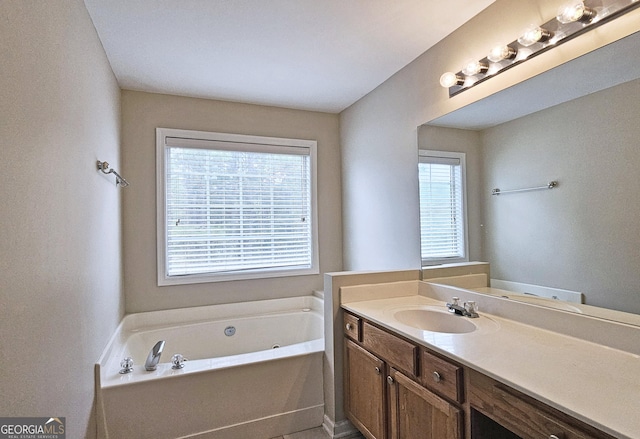 bathroom with a bath and vanity