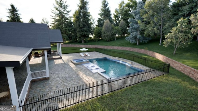 view of swimming pool featuring a yard, a patio, fence, and a pool with connected hot tub