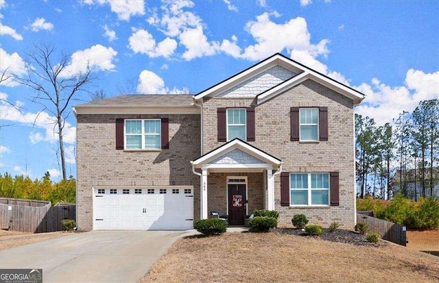 view of front of home featuring driveway, brick siding, an attached garage, and fence