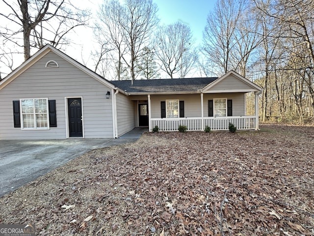 single story home featuring covered porch