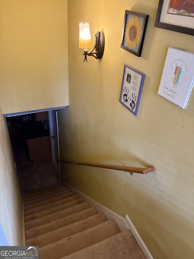 stairs featuring baseboards