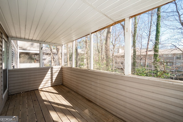 unfurnished sunroom featuring wooden ceiling