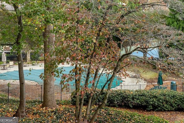 view of water feature with fence