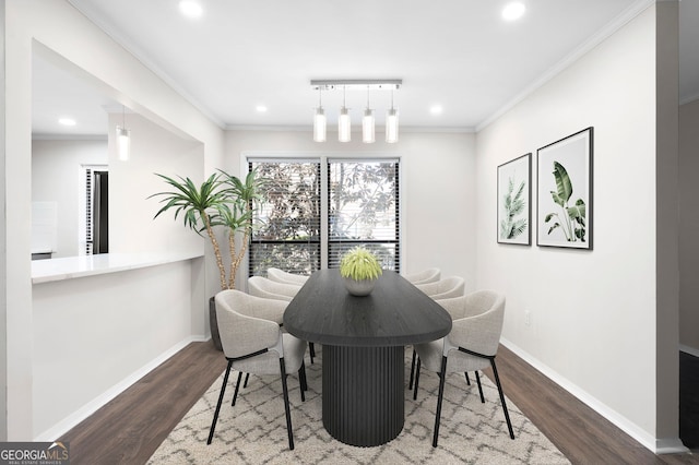 dining room featuring ornamental molding, recessed lighting, wood finished floors, and baseboards