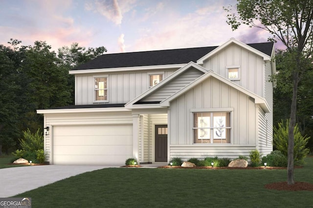 modern farmhouse featuring a garage, driveway, a front lawn, and board and batten siding