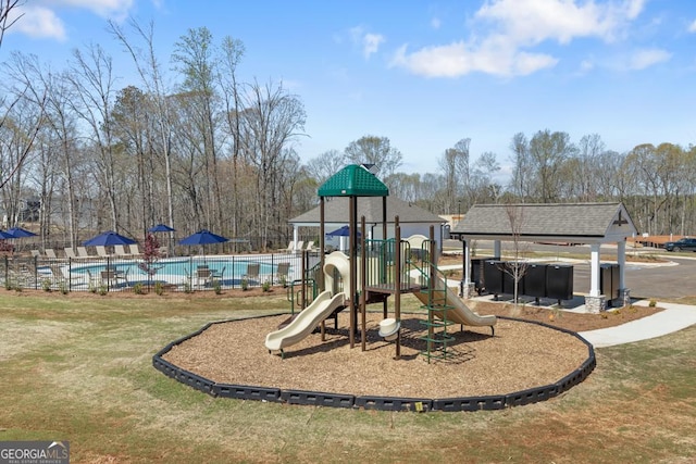 community playground featuring a community pool
