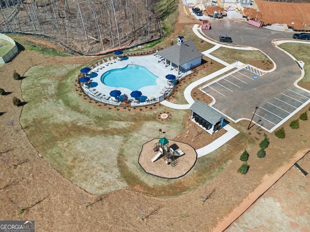 aerial overview of property's location featuring a pool