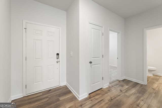 entrance foyer with wood finished floors and baseboards