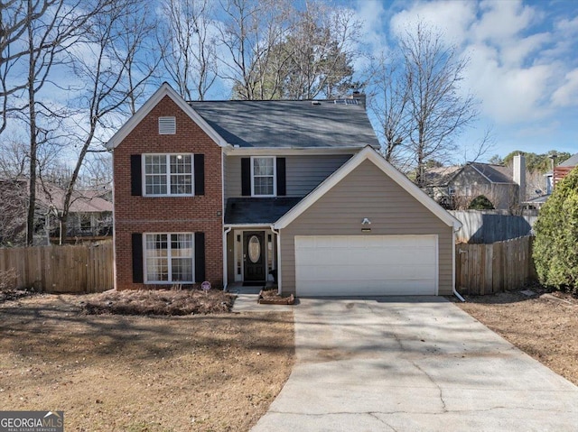 traditional-style house featuring a garage, brick siding, fence, and driveway