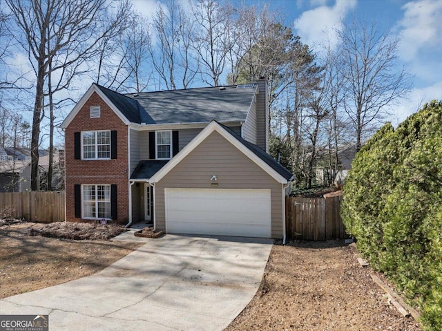 view of front of property with concrete driveway, brick siding, an attached garage, and fence