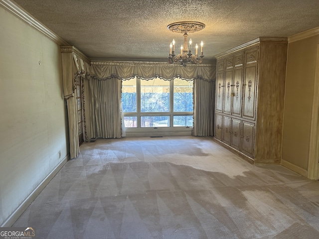 unfurnished dining area featuring light carpet, crown molding, a textured ceiling, and a notable chandelier