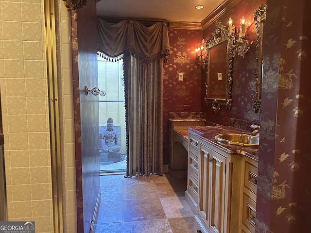 bathroom featuring wallpapered walls and vanity