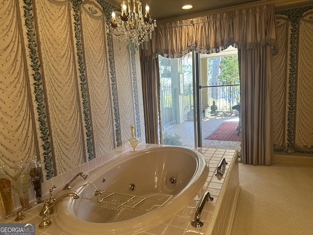 bathroom featuring a whirlpool tub and a notable chandelier