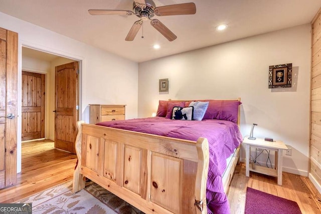 bedroom featuring baseboards, a ceiling fan, wood finished floors, and recessed lighting