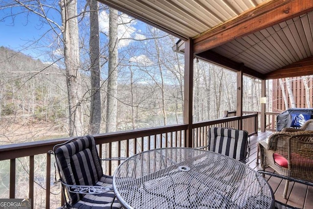 deck with outdoor dining area