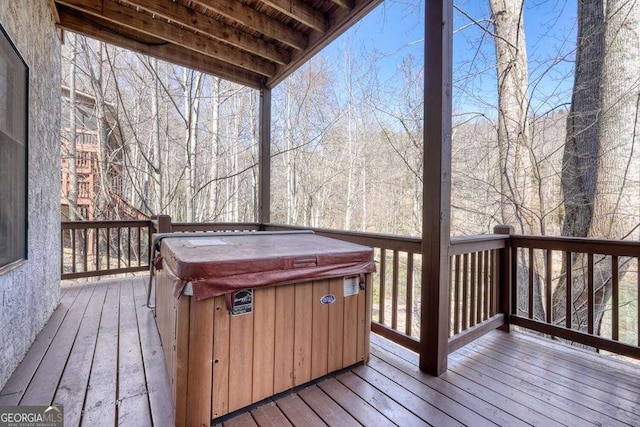 deck featuring a hot tub