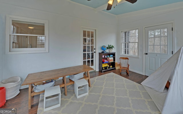 interior space featuring a ceiling fan and wood finished floors