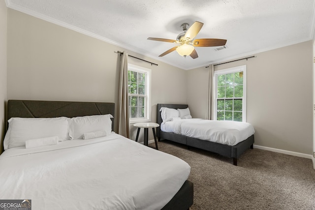 bedroom with carpet, multiple windows, visible vents, and crown molding