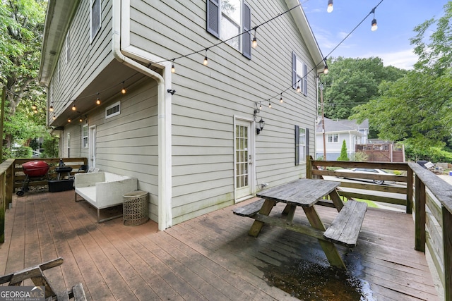 wooden deck featuring outdoor dining space