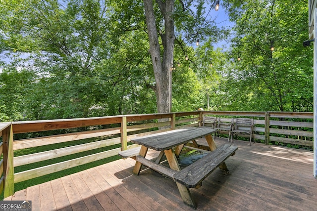 wooden deck featuring outdoor dining space