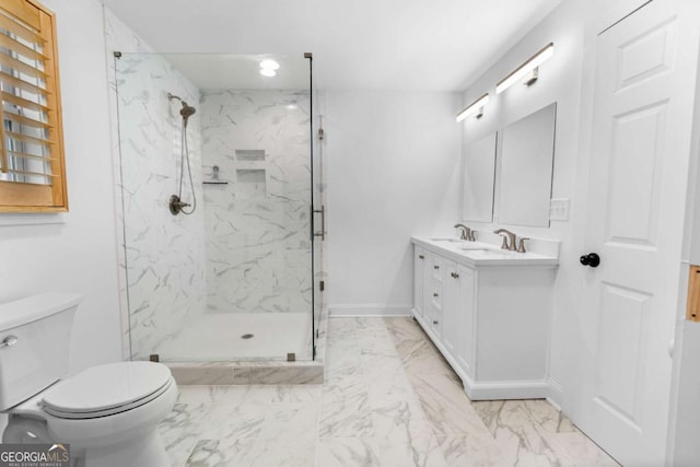 full bathroom featuring double vanity, a marble finish shower, baseboards, toilet, and marble finish floor