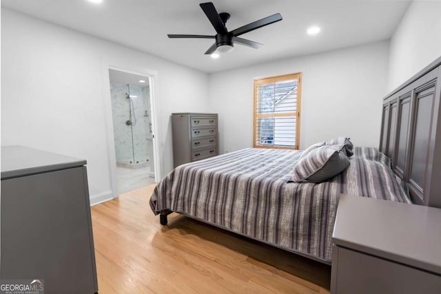 bedroom featuring ceiling fan, light wood-style flooring, recessed lighting, baseboards, and ensuite bath