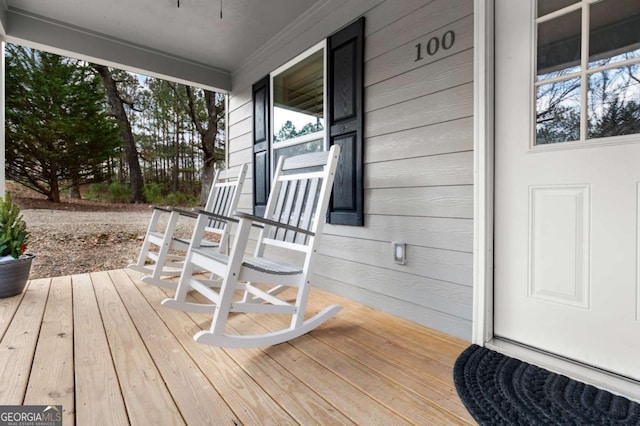 wooden terrace with a porch