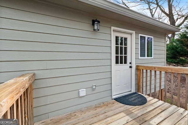 property entrance with a wooden deck