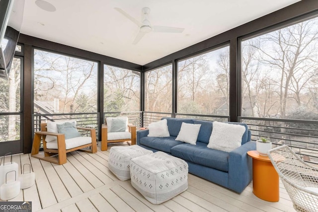 sunroom featuring a ceiling fan