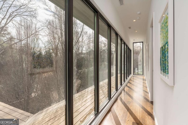 unfurnished sunroom with visible vents