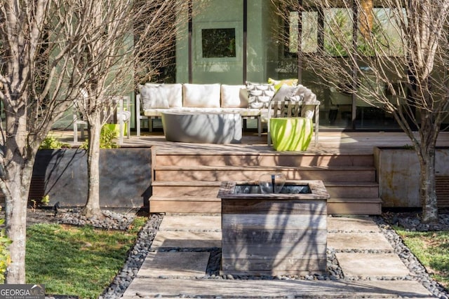 view of patio with a deck and an outdoor living space