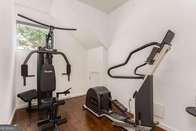 workout room with wood finished floors and baseboards