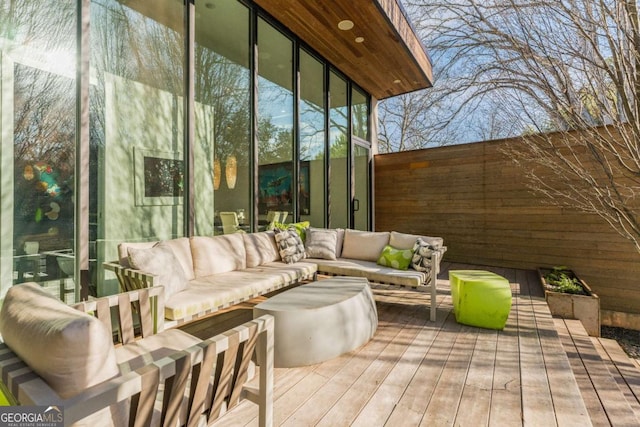 wooden deck with outdoor lounge area