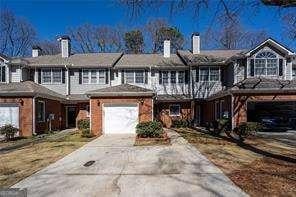 view of front of property with a garage and aphalt driveway