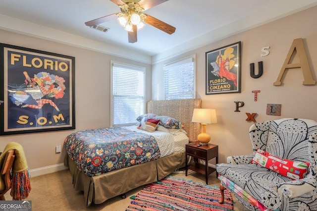 bedroom with ceiling fan, carpet, visible vents, and baseboards