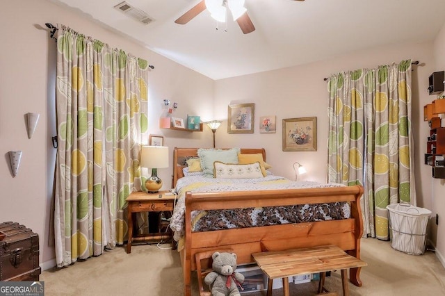 carpeted bedroom featuring ceiling fan and visible vents