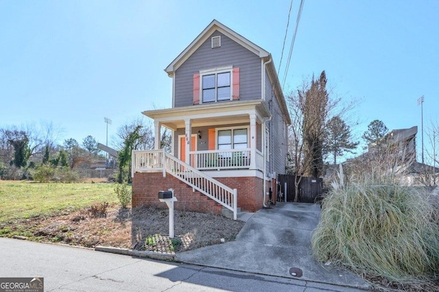 view of front of house with covered porch and stairway