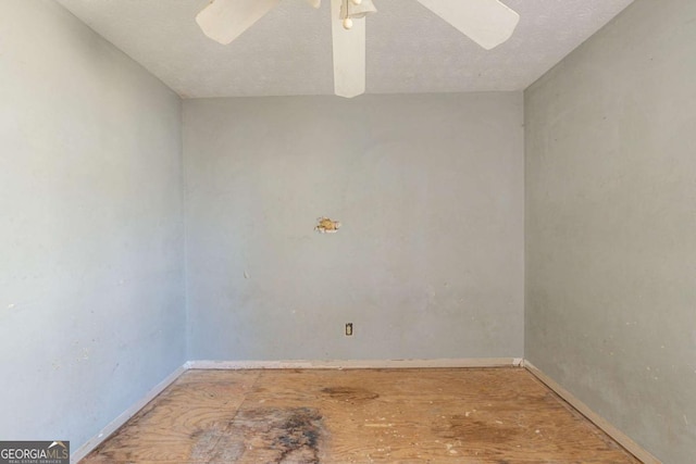 unfurnished room with baseboards and a ceiling fan